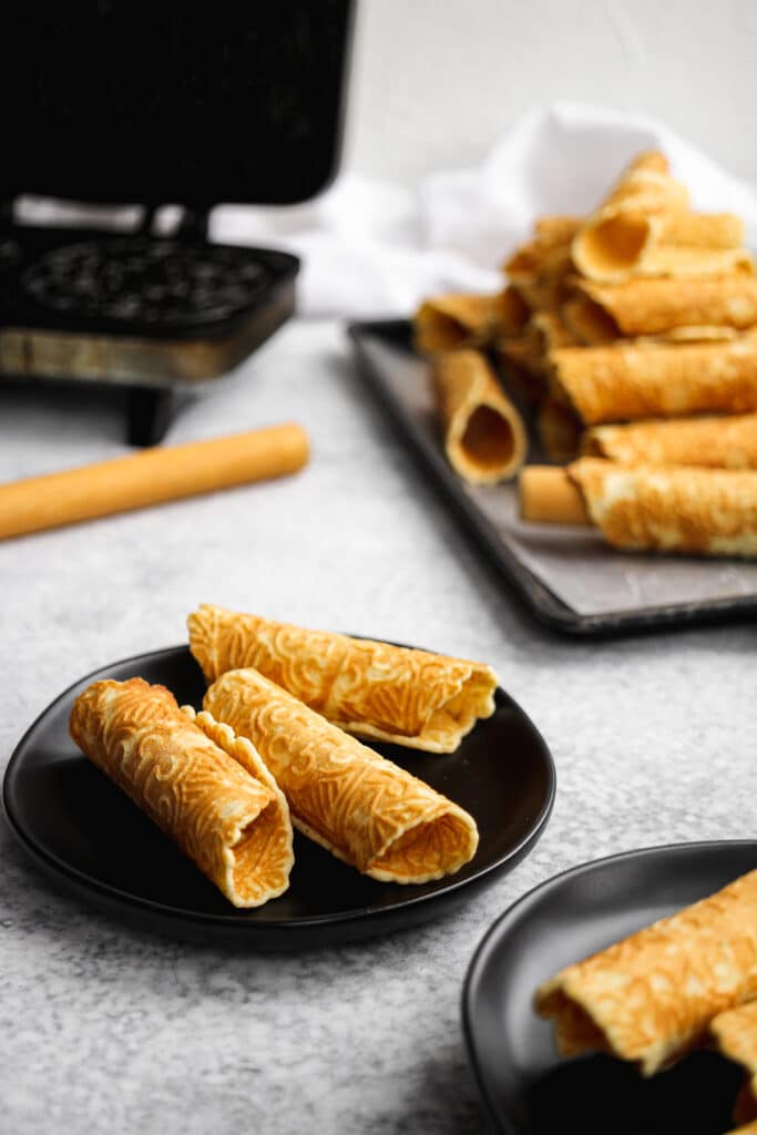 Plate of freshly made Norwegian krumkake cookies.