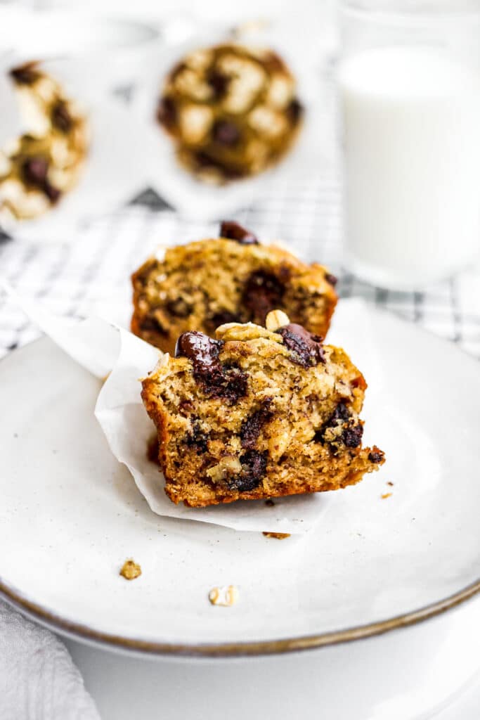 Close up view of a cut muffin with lots of chocolate.