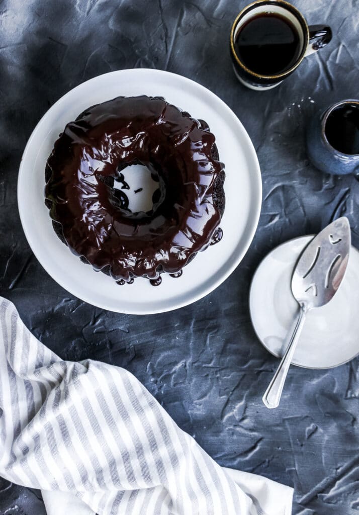 The sourdough discard chocolate cake after being glazed with the shiny ganache.