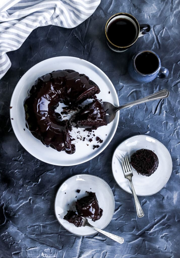 Serving slices of the sourdough discard chocolate cake.