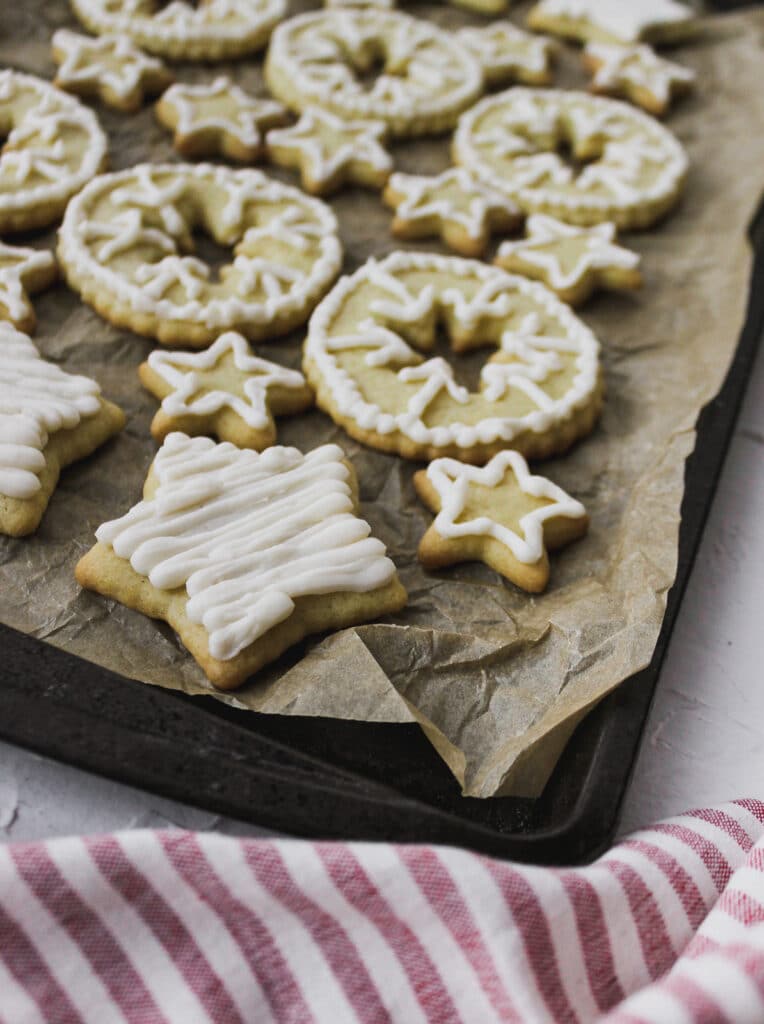 Close up of star sugar cookie with piped frosting.