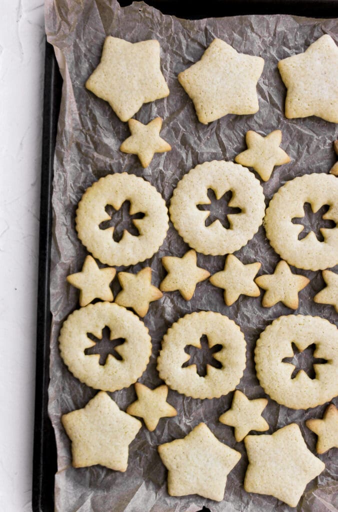 Baked sugar cookies on a baking tray.