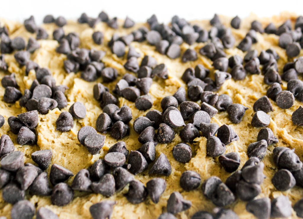 Chocolate chips are placed on top before baking.