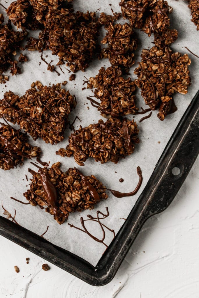 Large pieces of the double chocolate granola on a tray.