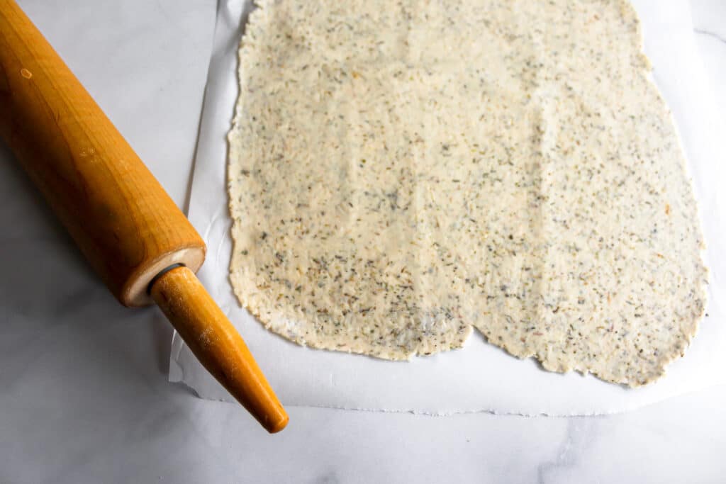 Cracker dough all rolled out and ready to cut into crackers.