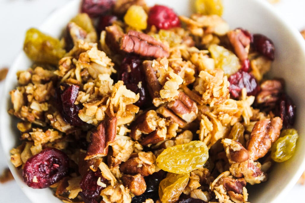 Bake the pecan granola and add the golden raisins and cranberries.