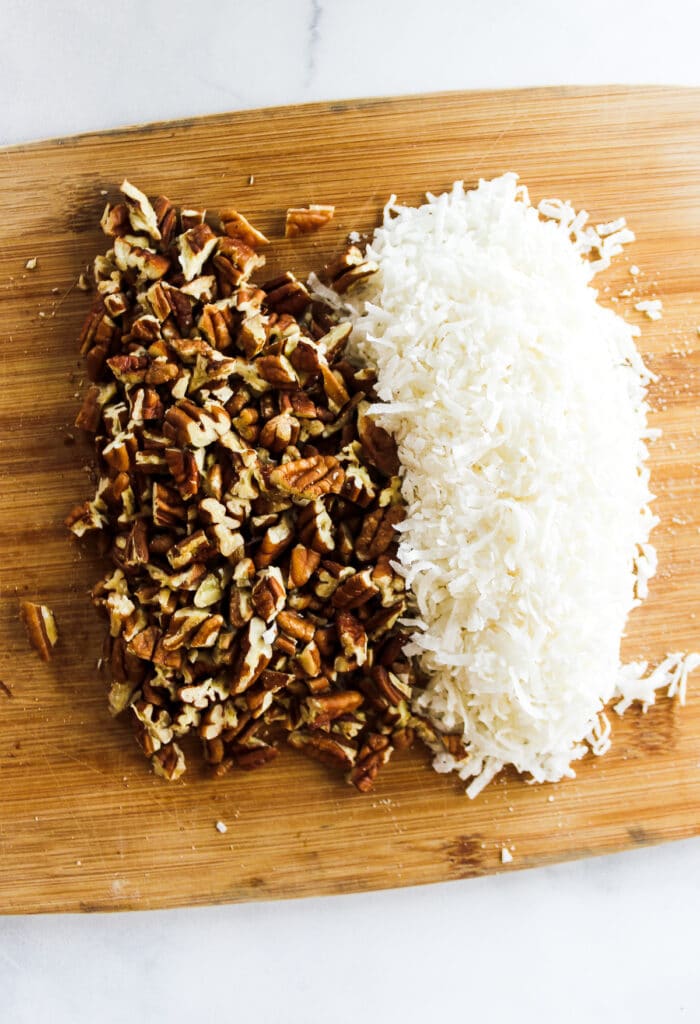 Chop the pecans and measure sweetened flaked coconut.