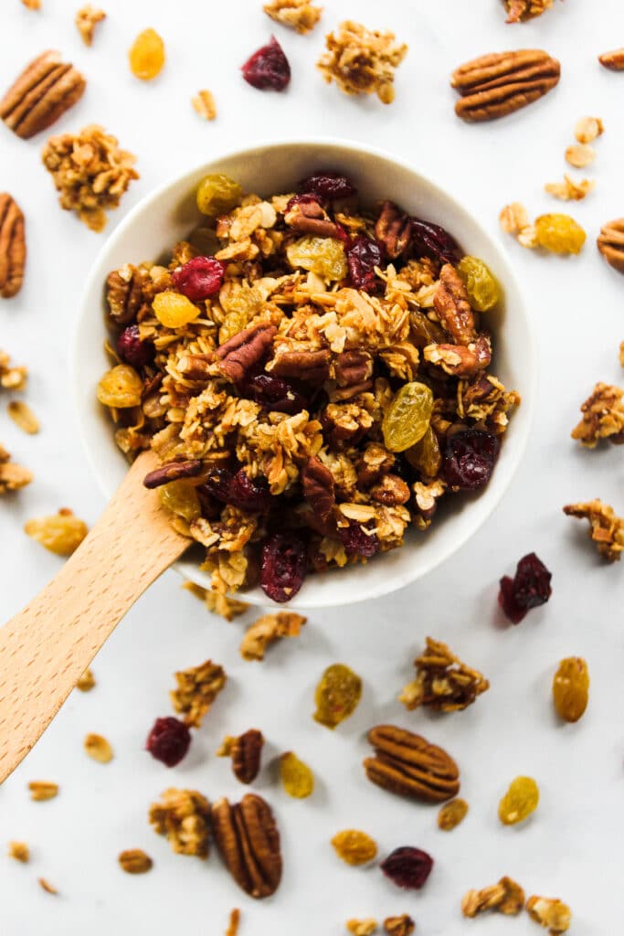 Overhead of fruit and nut granola in bowl.