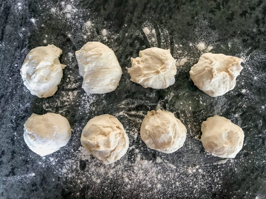 Balls of dough ready to be rolled.