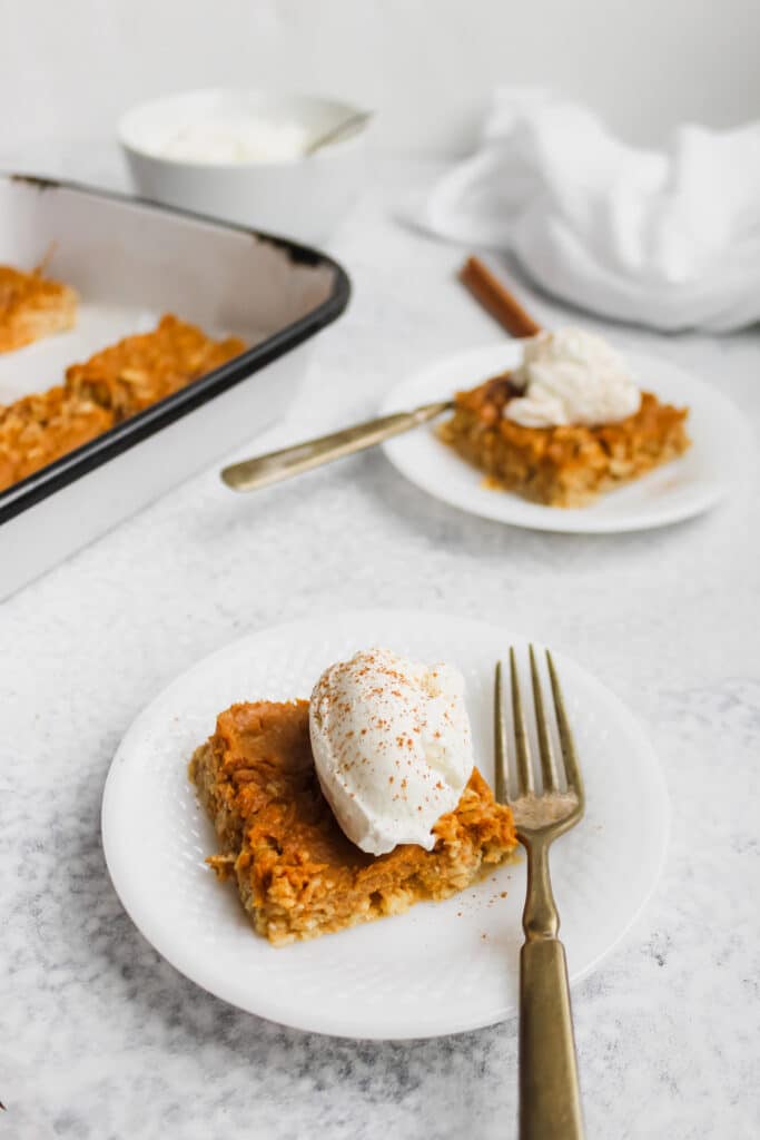 Pumpkin pie baked oats with whipped cream.