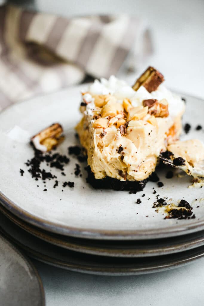 No bake snickers pie slice close-up.