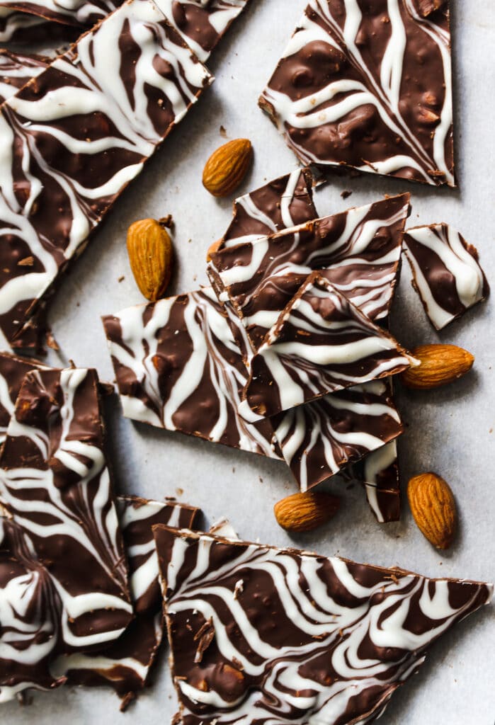 Swirled cholate bark with almonds shown in a stack.