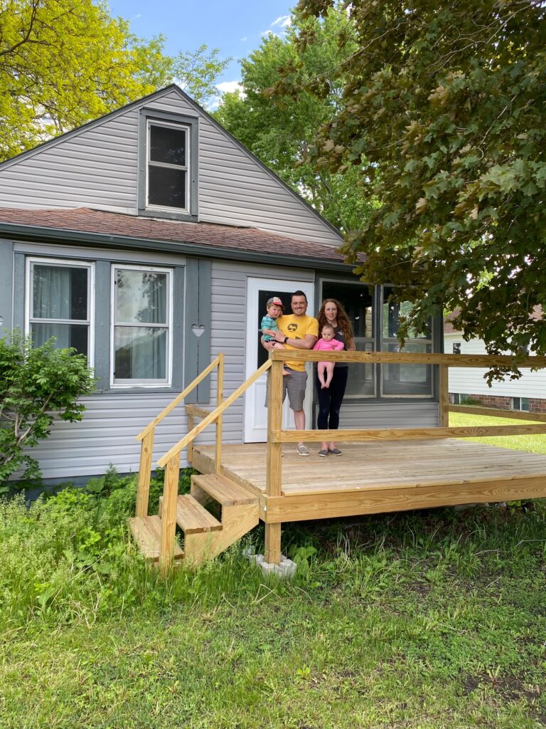 Here we are standing outside of the new house we purchased.